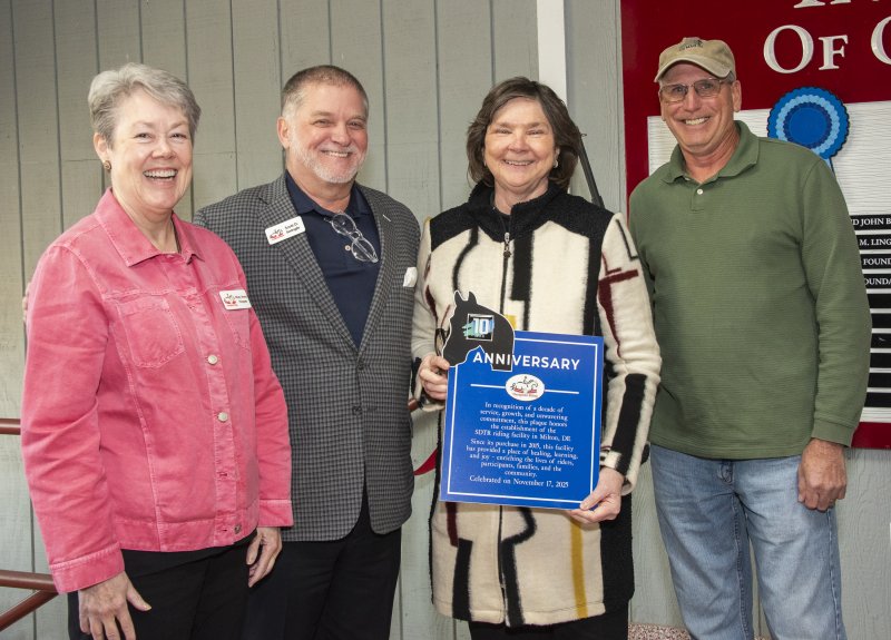 Shown with the plaque are (l-r) Mary Anne Hoopes, secretary; Scott Swingle, president; Linda Berdine, vice president; and Tom Peet, facility chair.